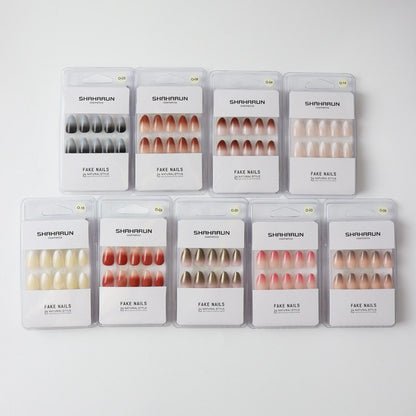 Ten sets of SHAHARUN cosmetics fake nails in assorted natural colors and styles on white background