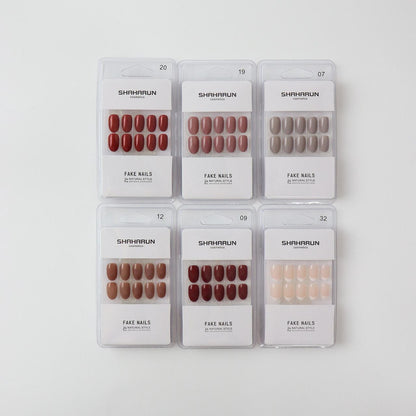 Six SHAHA RUN cosmetics packages of natural style fake nails in various brown and nude shades